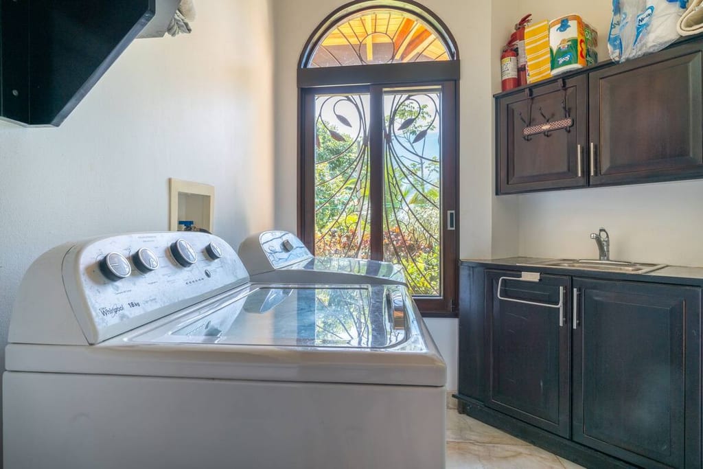 Laundry room with full-size washer and dryer