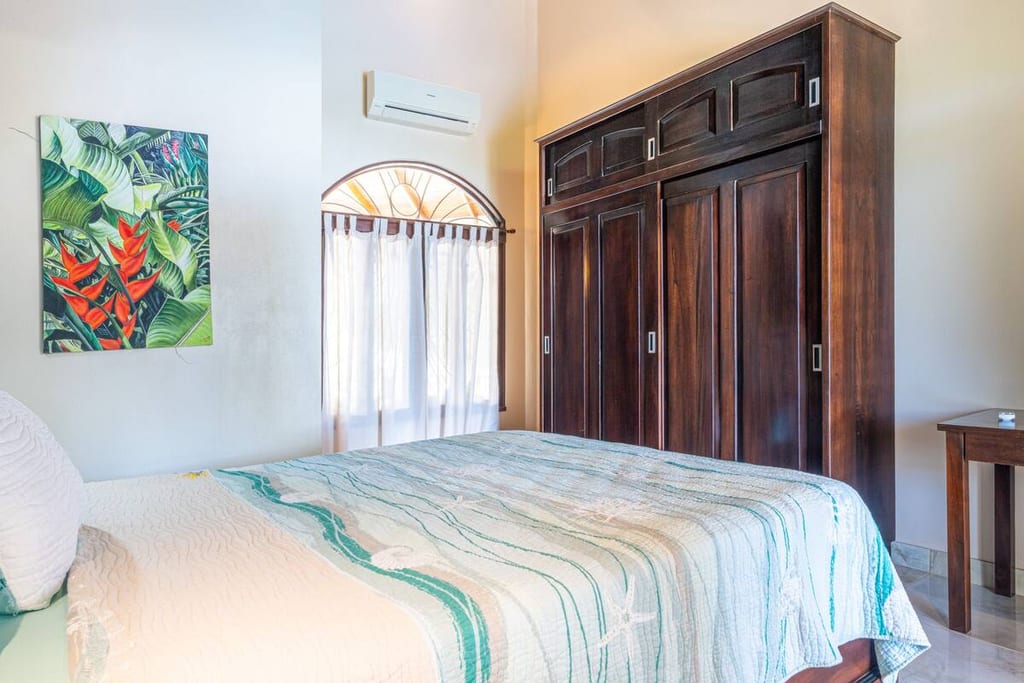 Guest bedroom with queen bed, built-in wardrobe and air conditioning