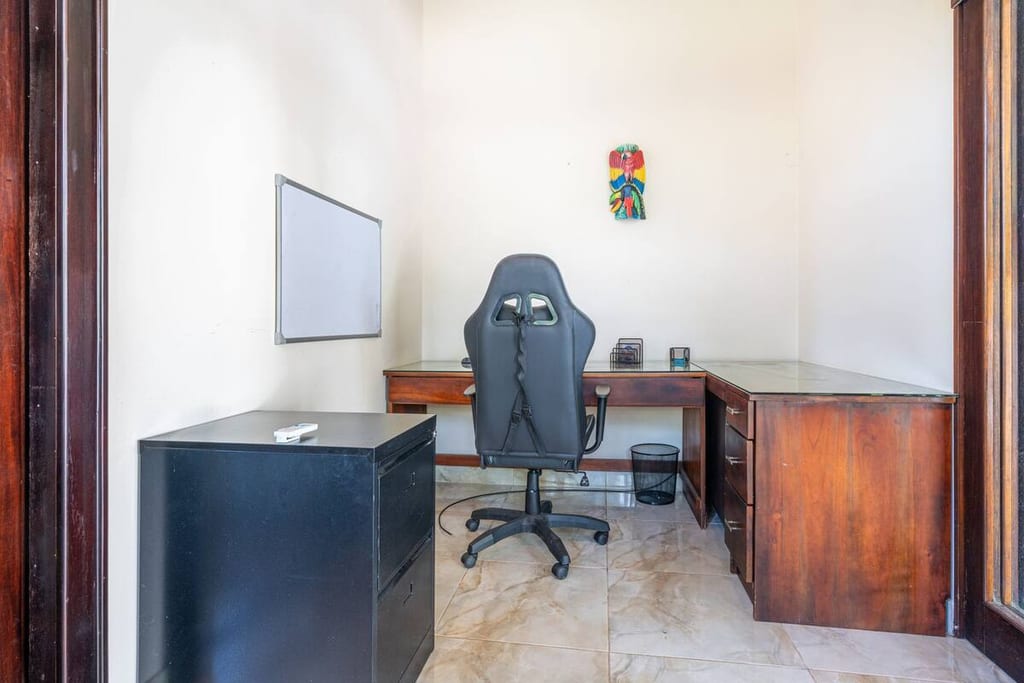 Second home office with desk and ergonomic chair for two people working at once